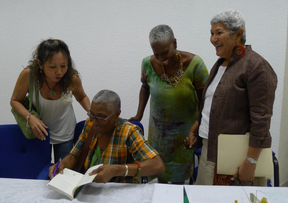 Dr. Velma Pollard signing copies of her book